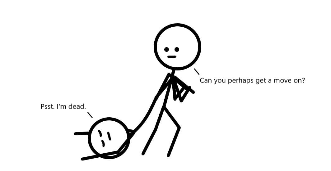 One person is dragging another by their legs