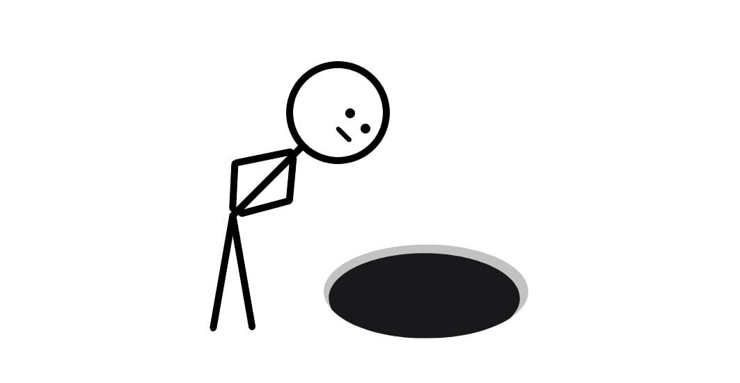 A person looking down a hole