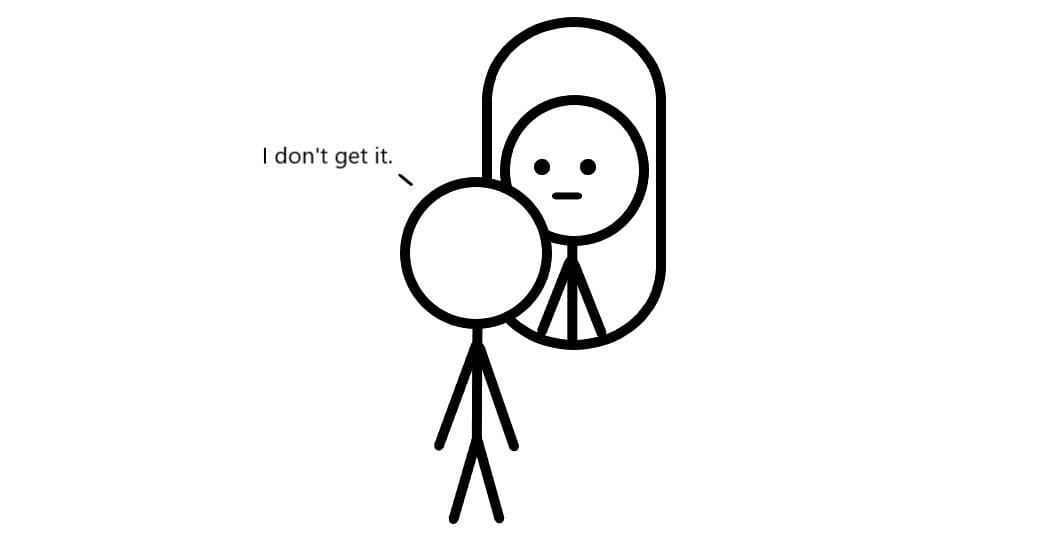 A person looking into a mirror not getting it